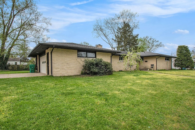 view of side of home featuring brick siding, an attached garage, a lawn, and driveway