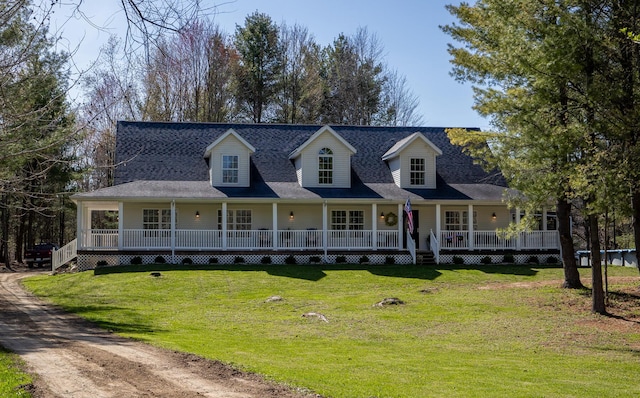 view of front of house featuring covered porch and a front yard