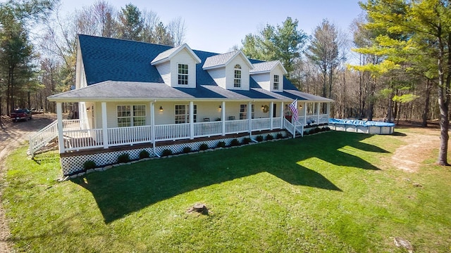 farmhouse inspired home with a porch, a covered pool, and a front yard
