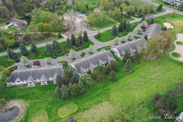 drone / aerial view featuring a residential view and view of golf course