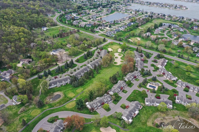 aerial view with a water view and a residential view