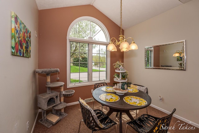 carpeted dining area featuring baseboards, vaulted ceiling, and an inviting chandelier