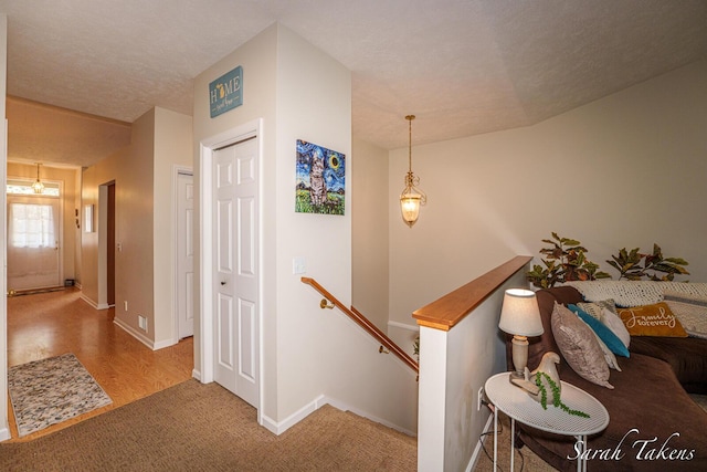 stairway with carpet floors and baseboards