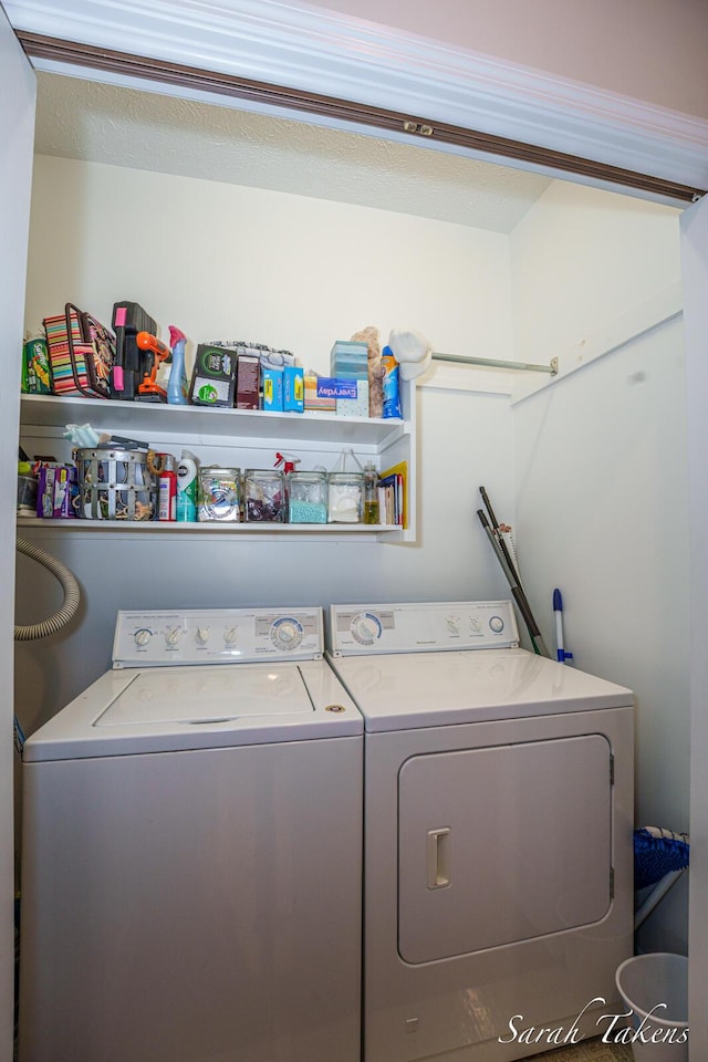 laundry room with separate washer and dryer and laundry area
