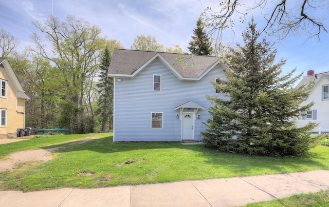 325 Pearl St, South Haven, MI 49090 - traditional-style home with roof with shingles and a front yard