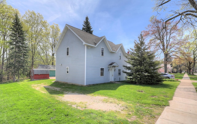 325 Pearl St, South Haven, MI 49090 - view of side of home featuring a lawn
