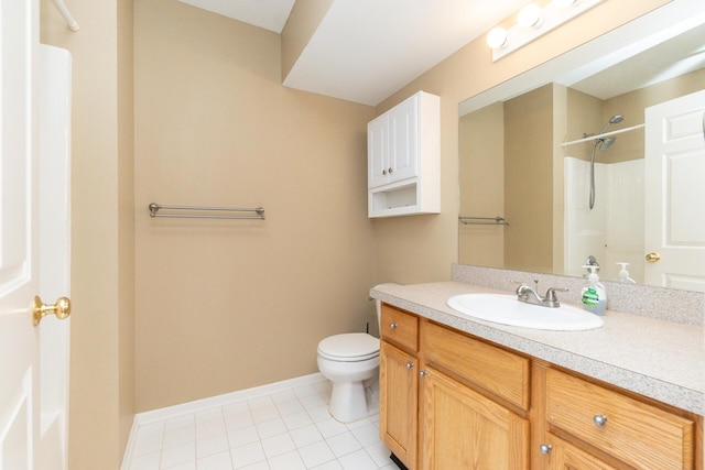 full bath featuring walk in shower, vanity, baseboards, tile patterned floors, and toilet