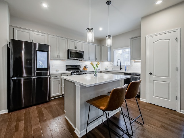 kitchen with smart refrigerator, range, stainless steel microwave, dark wood-style flooring, and recessed lighting