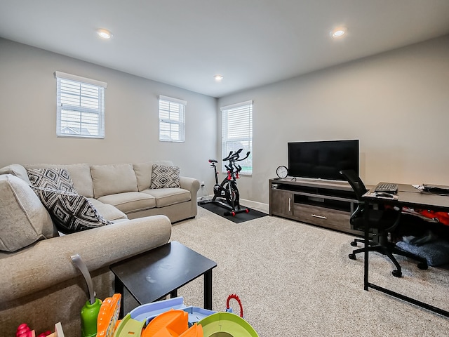 carpeted living area featuring recessed lighting, an office area, and baseboards