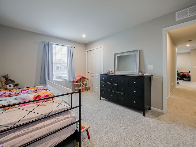 carpeted bedroom featuring a closet, recessed lighting, and baseboards