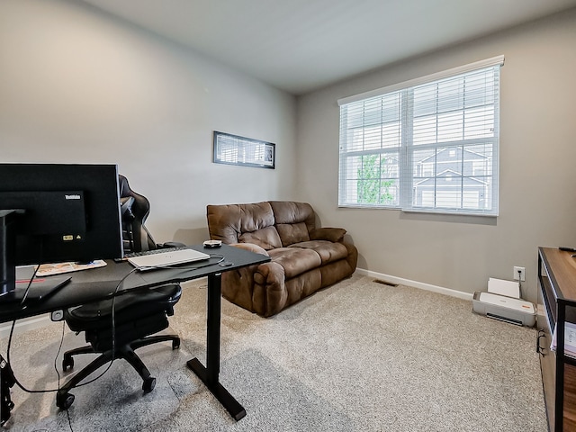 home office with baseboards and carpet floors