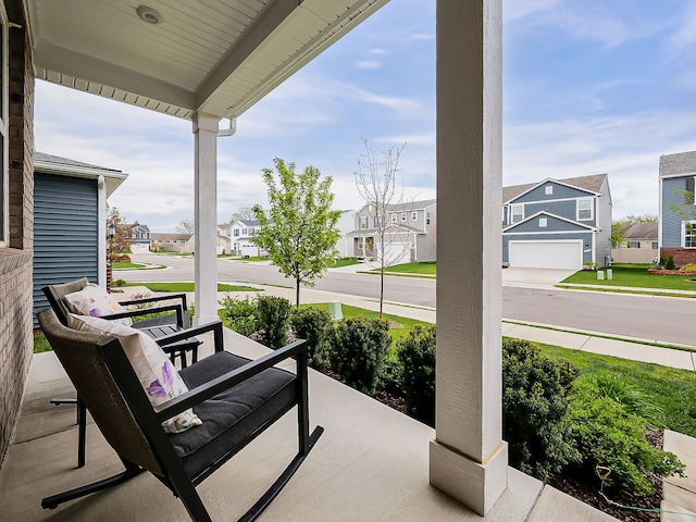 view of patio / terrace featuring a porch and a residential view