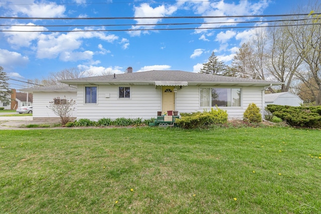 single story home featuring a shingled roof, a chimney, and a front yard