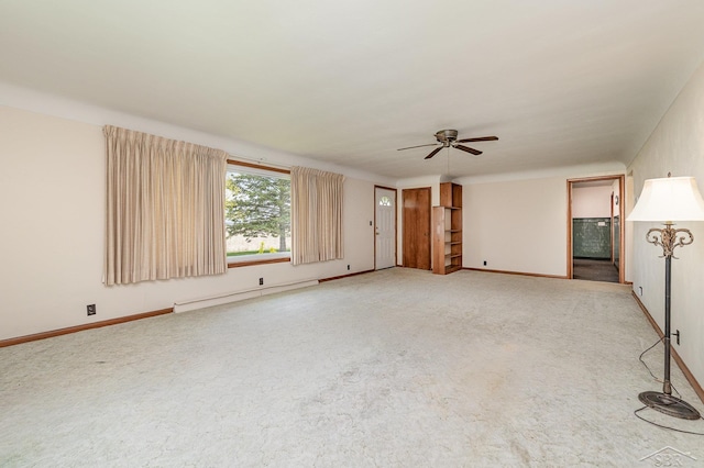 unfurnished living room with light colored carpet, a baseboard radiator, baseboards, and a ceiling fan