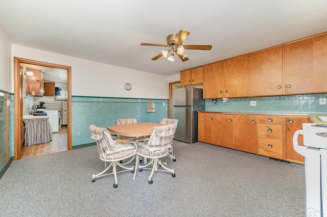 dining room with wainscoting and a ceiling fan