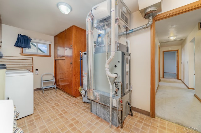utility room with washer / clothes dryer, water heater, heating unit, and visible vents