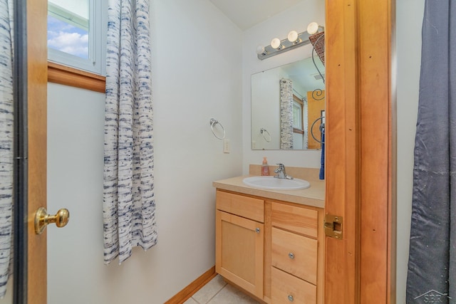 bathroom with tile patterned floors and vanity