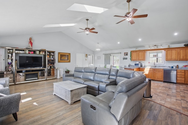 15756 Lewis Rd, Mussey, MI 48014 - living room with a skylight, a ceiling fan, vaulted ceiling, light wood-style floors, and recessed lighting