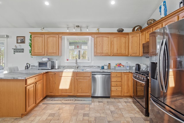15756 Lewis Rd, Mussey, MI 48014 - kitchen with appliances with stainless steel finishes, a peninsula, light stone countertops, a sink, and plenty of natural light