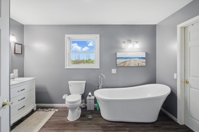 15756 Lewis Rd, Mussey, MI 48014 - full bath featuring wood finished floors, a freestanding bath, vanity, and baseboards