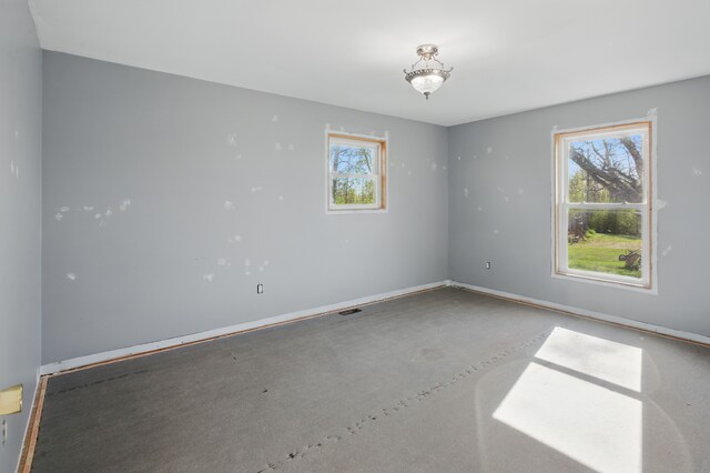 15756 Lewis Rd, Mussey, MI 48014 - empty room featuring concrete flooring and baseboards