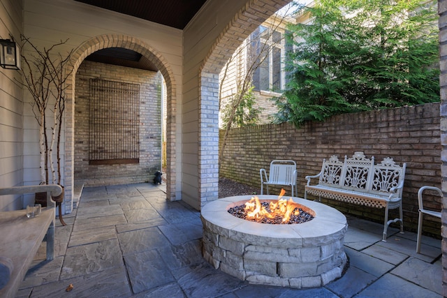 view of patio featuring an outdoor fire pit