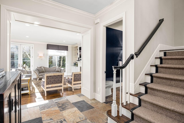 foyer with ornamental molding, stairs, baseboards, stone finish floor, and recessed lighting