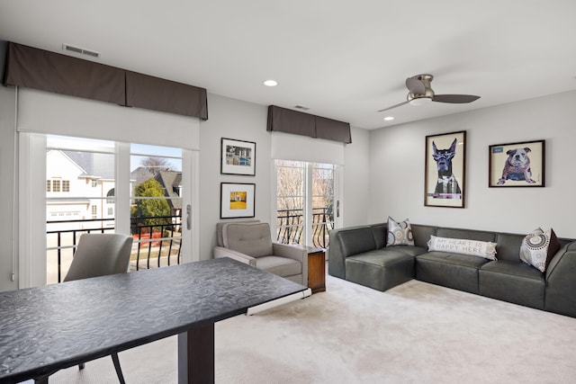 living area featuring recessed lighting, a ceiling fan, carpet flooring, and visible vents