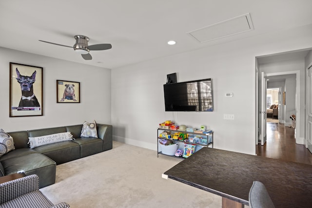 living area with carpet flooring, attic access, a ceiling fan, baseboards, and recessed lighting