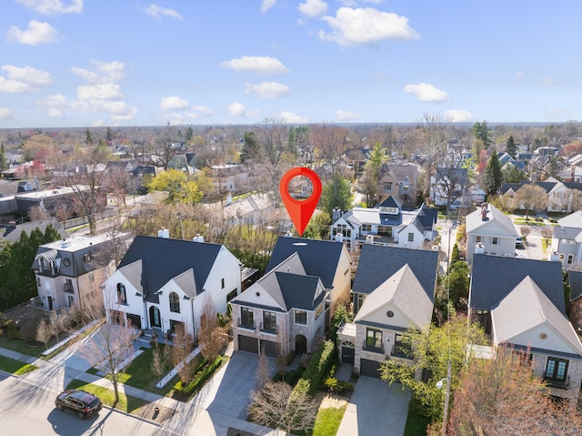 birds eye view of property with a residential view