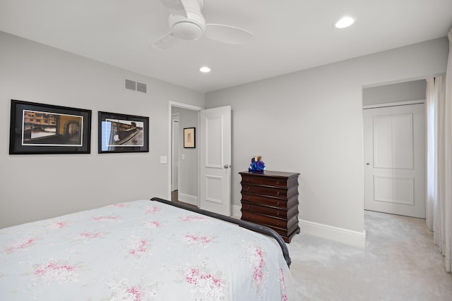 bedroom featuring baseboards, light carpet, recessed lighting, and visible vents