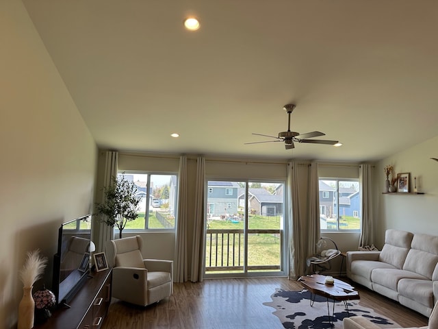 living area with ceiling fan, recessed lighting, and wood finished floors