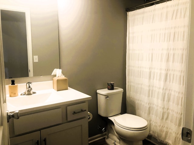bathroom with vanity, toilet, and a shower with curtain