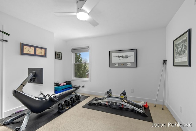 workout area featuring baseboards, carpet, and ceiling fan