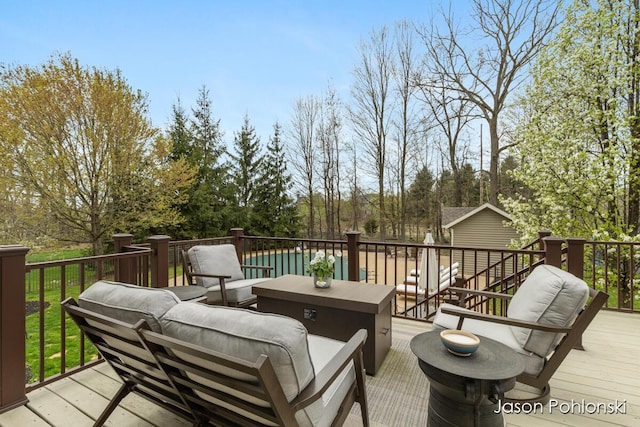 wooden terrace featuring outdoor lounge area