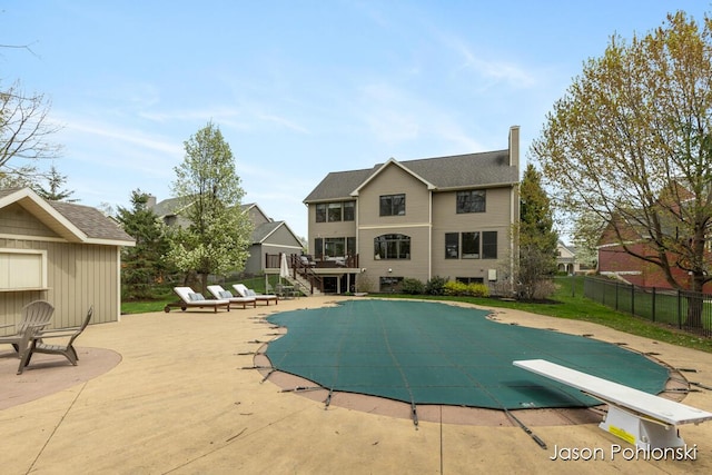 view of swimming pool with a fenced in pool, a patio area, and fence