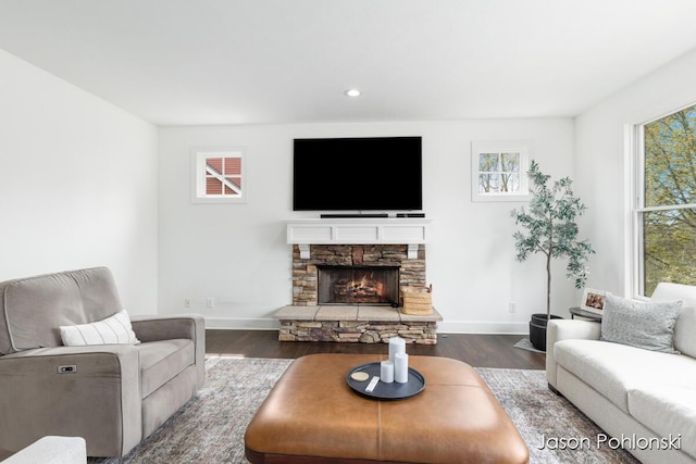 living area with recessed lighting, baseboards, dark wood finished floors, and a fireplace