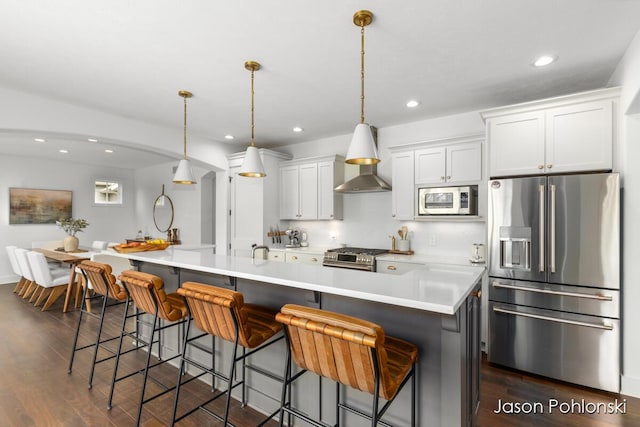 kitchen with light countertops, white cabinetry, dark wood-style floors, and stainless steel appliances