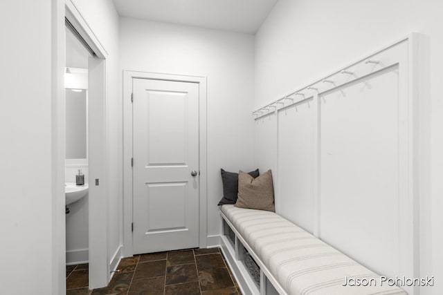 mudroom featuring stone finish flooring