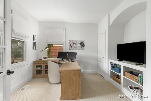 home office with baseboards and visible vents