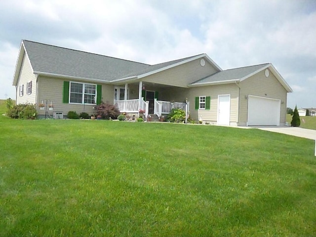 ranch-style home with an attached garage, driveway, a front yard, and a porch