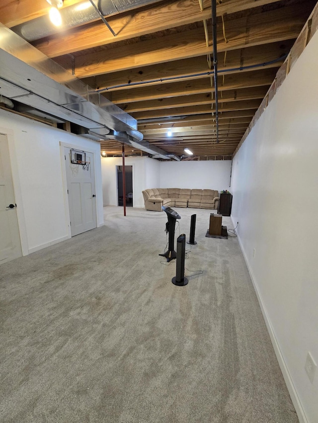 finished basement featuring carpet floors and baseboards