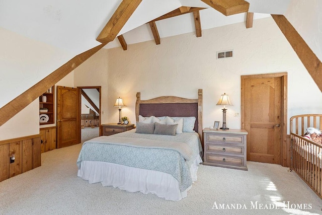 bedroom featuring visible vents, lofted ceiling with beams, and carpet flooring