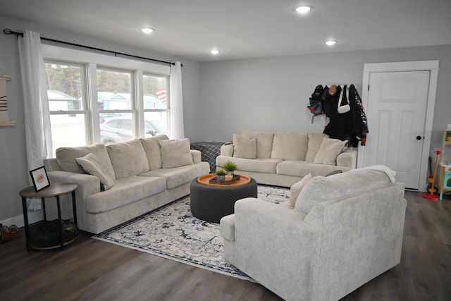 living area featuring recessed lighting and dark wood-style flooring