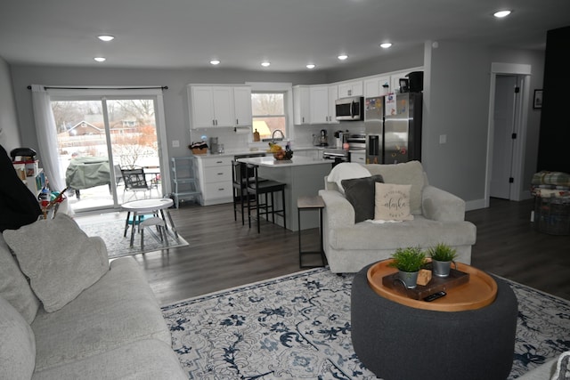 living room featuring recessed lighting and wood finished floors