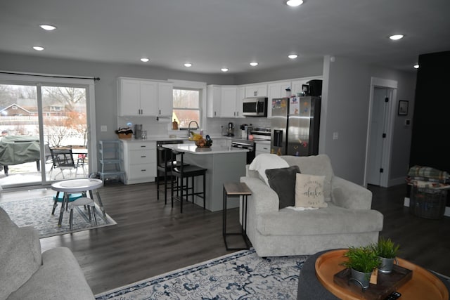 living room featuring recessed lighting and wood finished floors