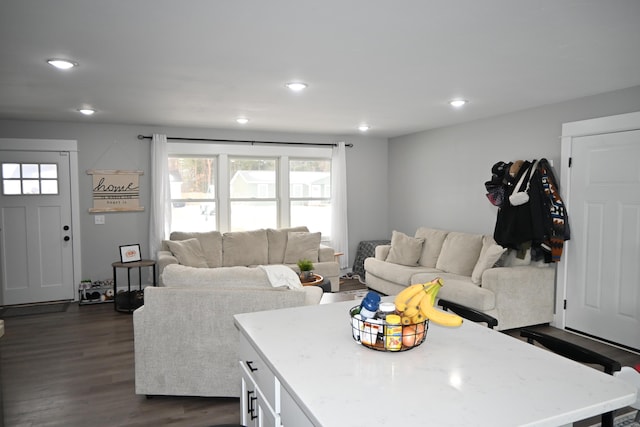 living room featuring recessed lighting and dark wood-style flooring