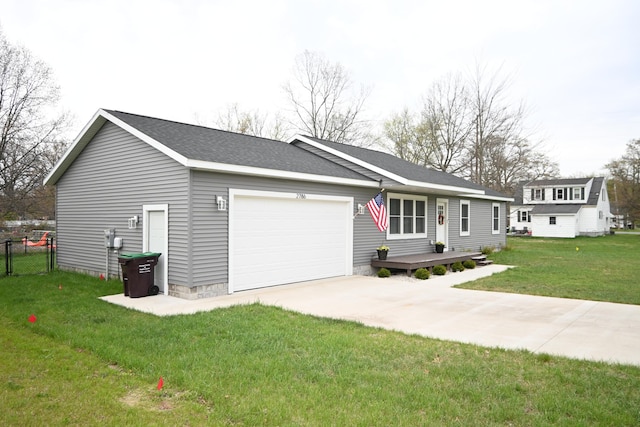 ranch-style house with a front lawn, fence, roof with shingles, concrete driveway, and an attached garage