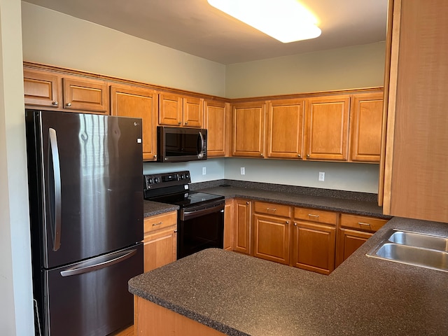 5 Bradford, Dearborn, MI 48126 - kitchen featuring freestanding refrigerator, black range with electric stovetop, dark countertops, and brown cabinets