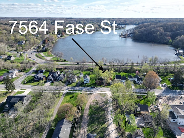 aerial view with a water view and a residential view